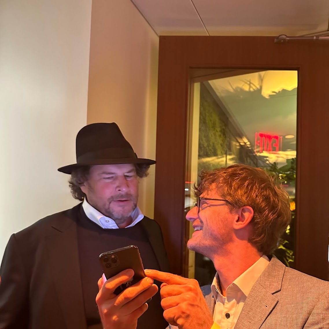 A photo I took of Marc Benioff with Richard Socher, discussing upcoming you.com product features