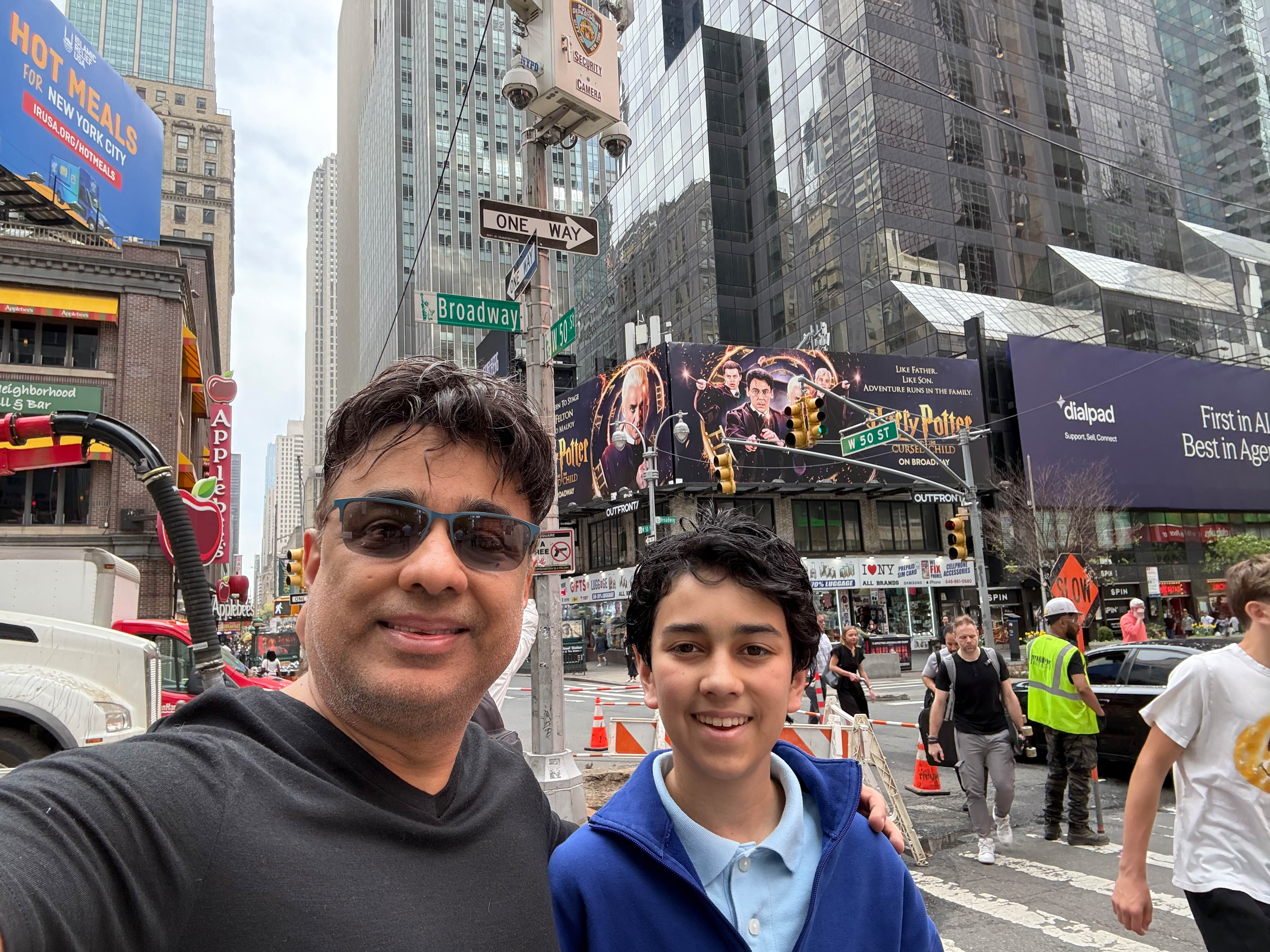 Fitz and me on Broadway, the Harry Potter and the Cursed Child billboard behind us